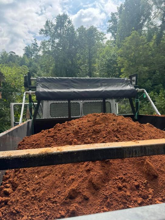 Dump truck delivering gravel